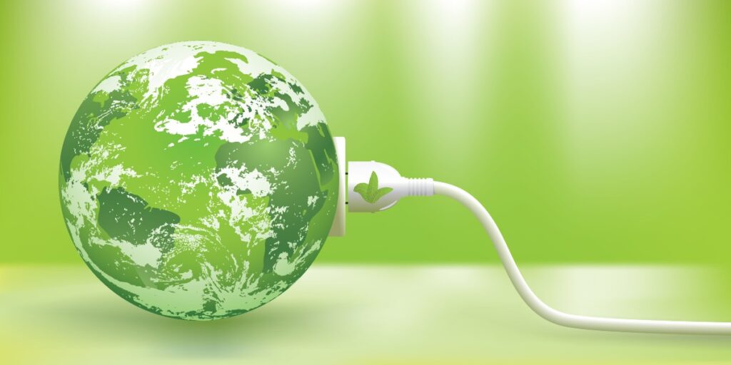 tomada conectada a um globo ecológico para representar uma forma de como economizar energia